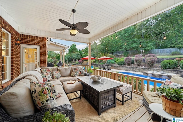 view of patio featuring ceiling fan, a swimming pool, and an outdoor hangout area