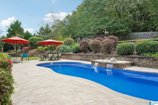 view of pool featuring a patio area and pool water feature