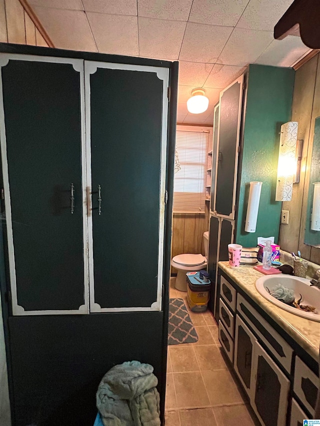 bathroom with tile patterned floors, vanity, and toilet