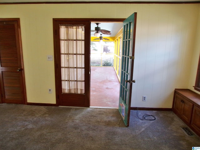 doorway with carpet, french doors, baseboards, and visible vents
