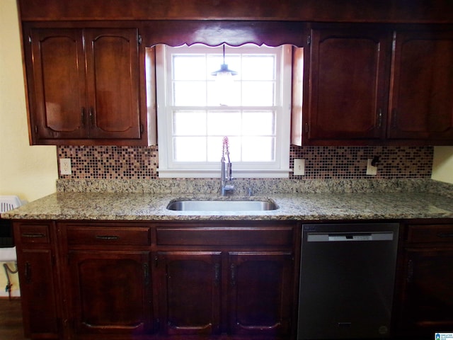 kitchen featuring a sink, decorative backsplash, light stone counters, and dishwashing machine