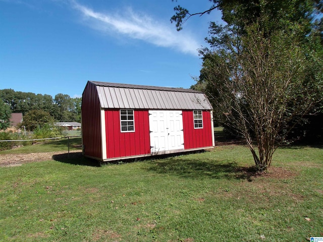 view of shed featuring fence
