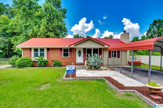 ranch-style house featuring a front lawn, a carport, and covered porch