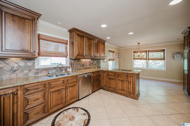 kitchen with a wealth of natural light, dishwasher, kitchen peninsula, and sink