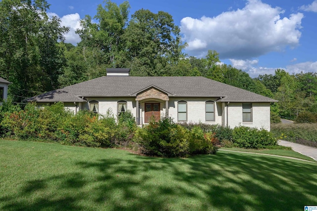 ranch-style house featuring a front lawn