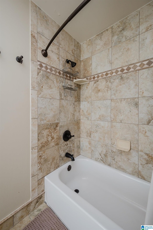 bathroom with tile patterned flooring and tiled shower / bath combo