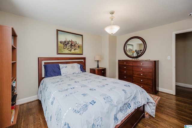 bedroom with dark wood-type flooring