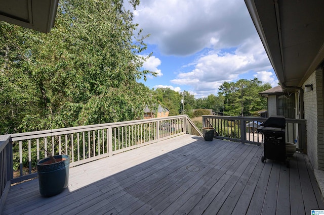 wooden deck with area for grilling