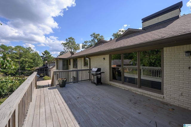 wooden deck featuring grilling area