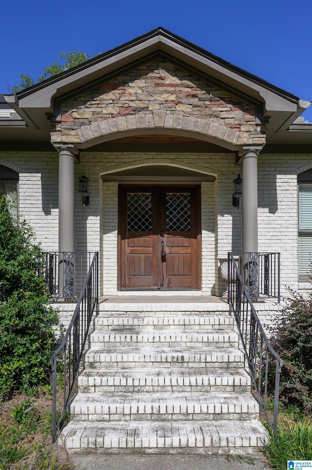 view of exterior entry with covered porch