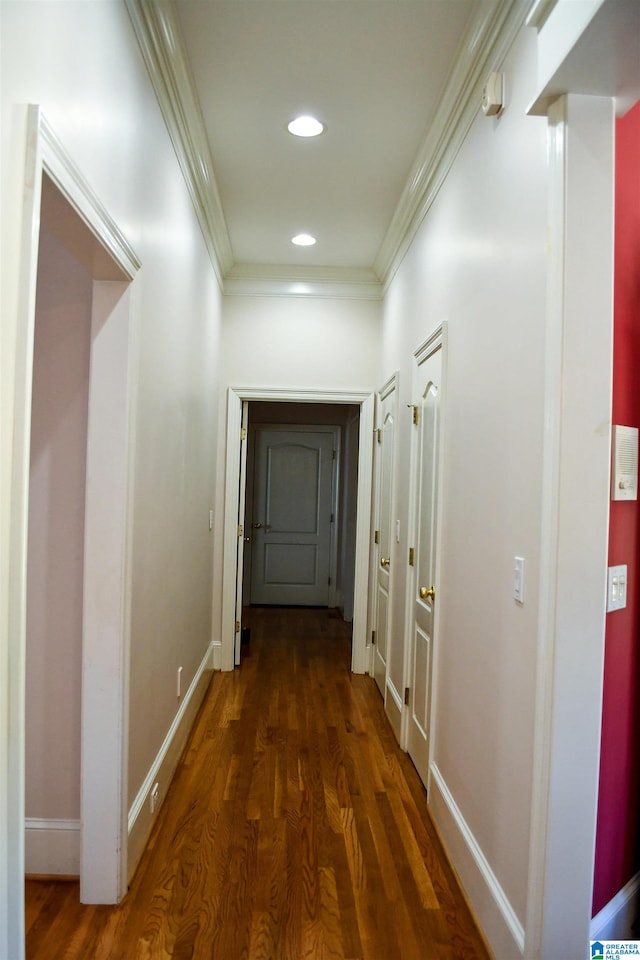 hall with crown molding and dark hardwood / wood-style floors