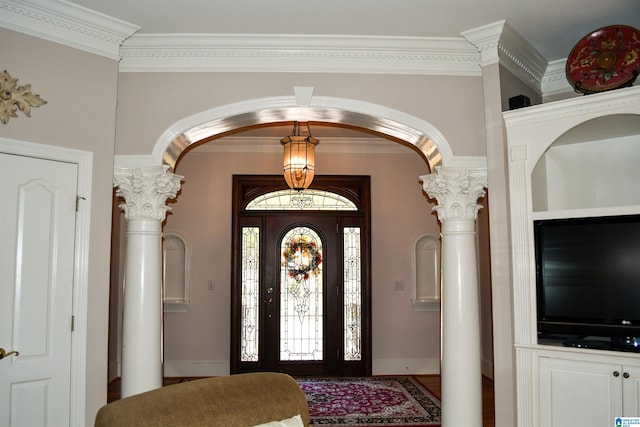 foyer entrance with ornamental molding and ornate columns