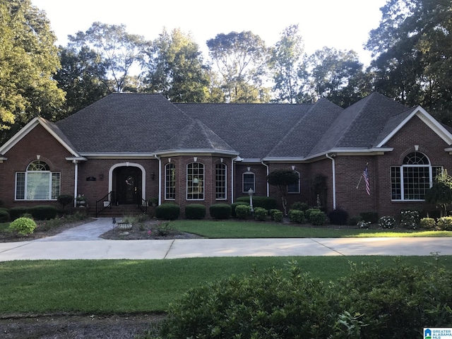 ranch-style home with a front yard