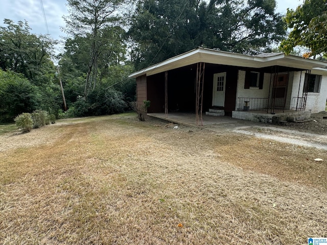 exterior space with a yard and a porch