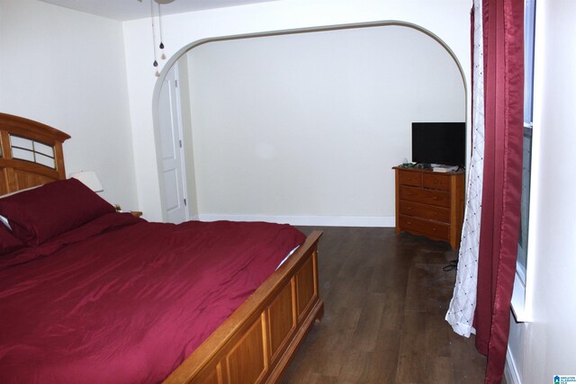 bedroom featuring dark hardwood / wood-style flooring