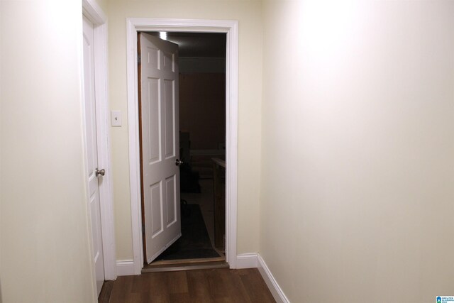 hall with dark hardwood / wood-style flooring