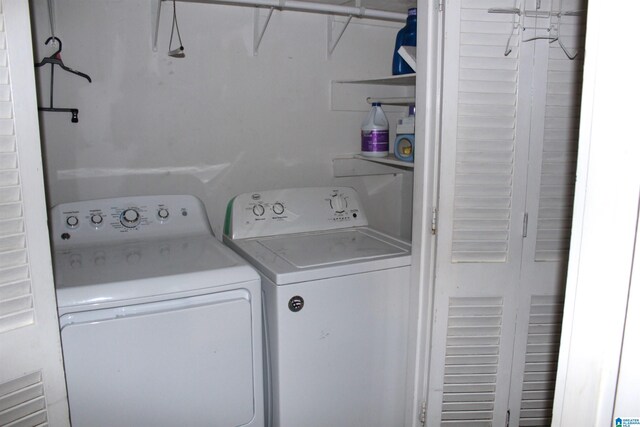 clothes washing area with independent washer and dryer