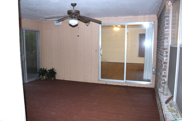 interior space featuring ceiling fan