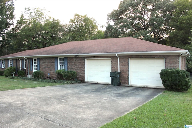 view of front facade with a garage and a front lawn