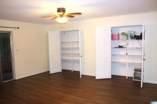 unfurnished bedroom featuring a textured ceiling, dark hardwood / wood-style floors, and ceiling fan