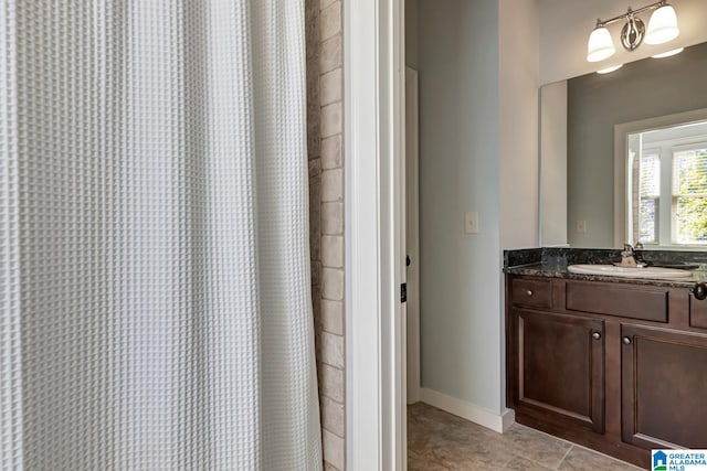 bathroom featuring vanity, tile patterned floors, and a shower with curtain