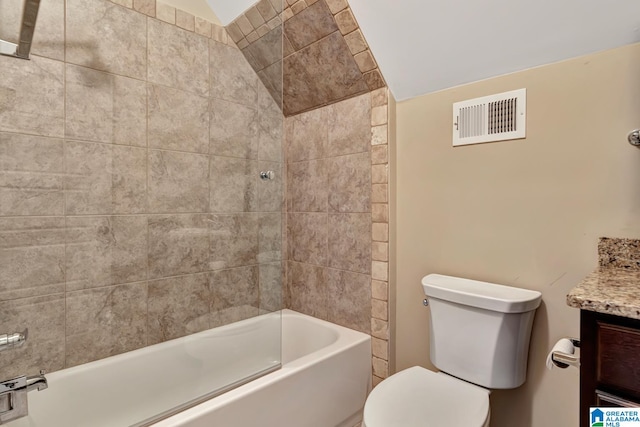 full bathroom with toilet, vanity, tiled shower / bath combo, and lofted ceiling