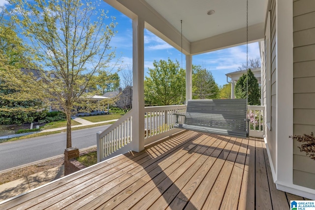 wooden deck featuring covered porch