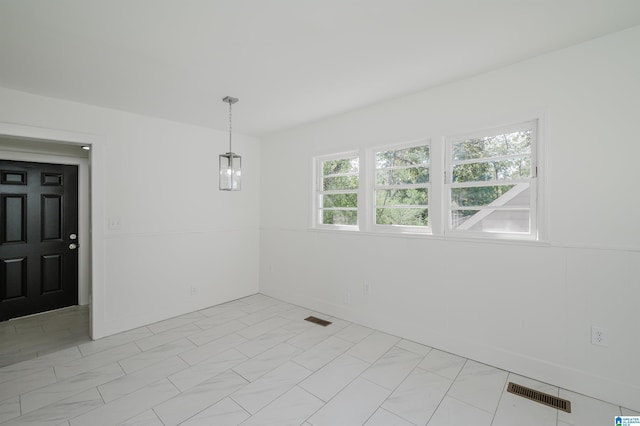 unfurnished room featuring visible vents and marble finish floor