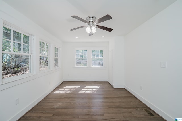 spare room with ceiling fan, visible vents, recessed lighting, wood finished floors, and baseboards