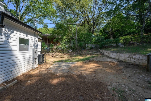 view of yard with central AC