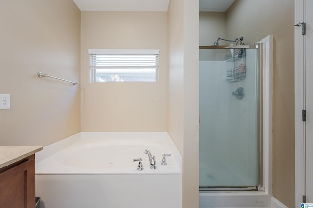 bathroom with plus walk in shower and vanity