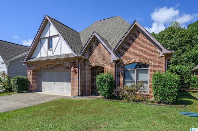 view of front of house with a garage and a front yard