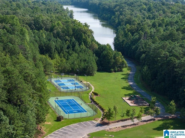 birds eye view of property with a water view