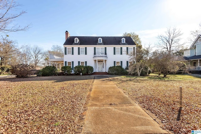 305 S St E, Talladega, AL 35160 - view of front of house with a balcony and a chimney