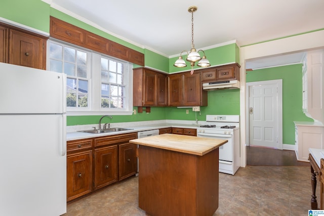 kitchen featuring pendant lighting, sink, wooden counters, white appliances, and a kitchen island