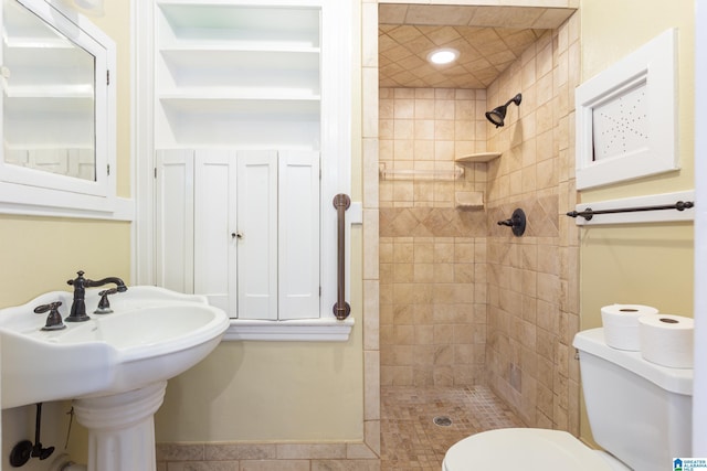 305 S St E, Talladega, AL 35160 - bathroom with a sink, toilet, and a stall shower