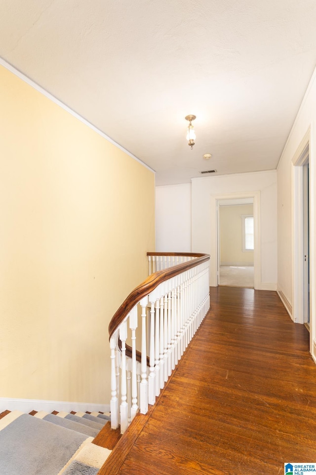 305 S St E, Talladega, AL 35160 - hall featuring visible vents, baseboards, an upstairs landing, and wood finished floors