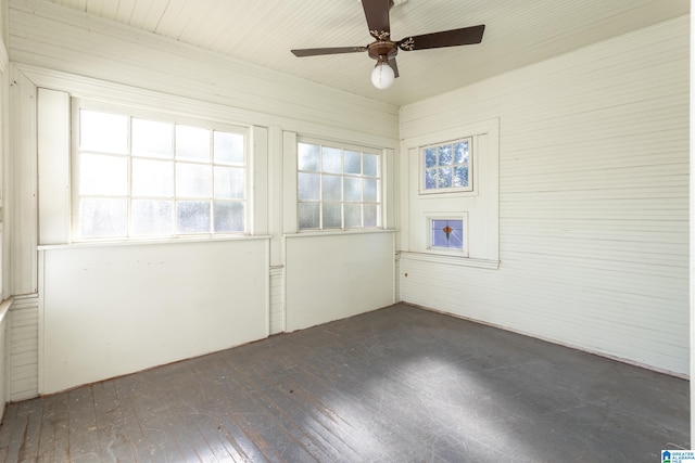 spare room featuring dark hardwood / wood-style floors and ceiling fan