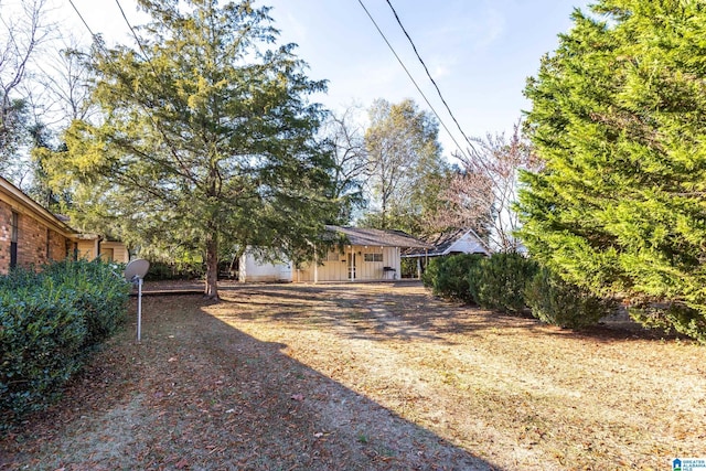 305 S St E, Talladega, AL 35160 - view of front of house with board and batten siding