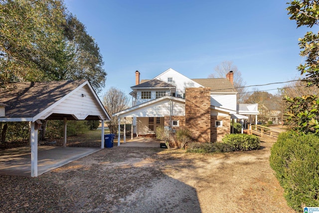 view of front of property featuring a carport