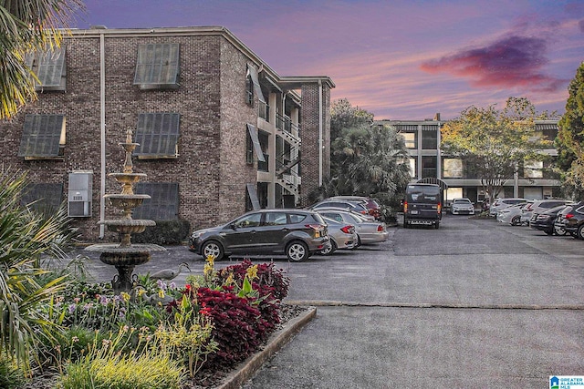 view of outdoor building at dusk