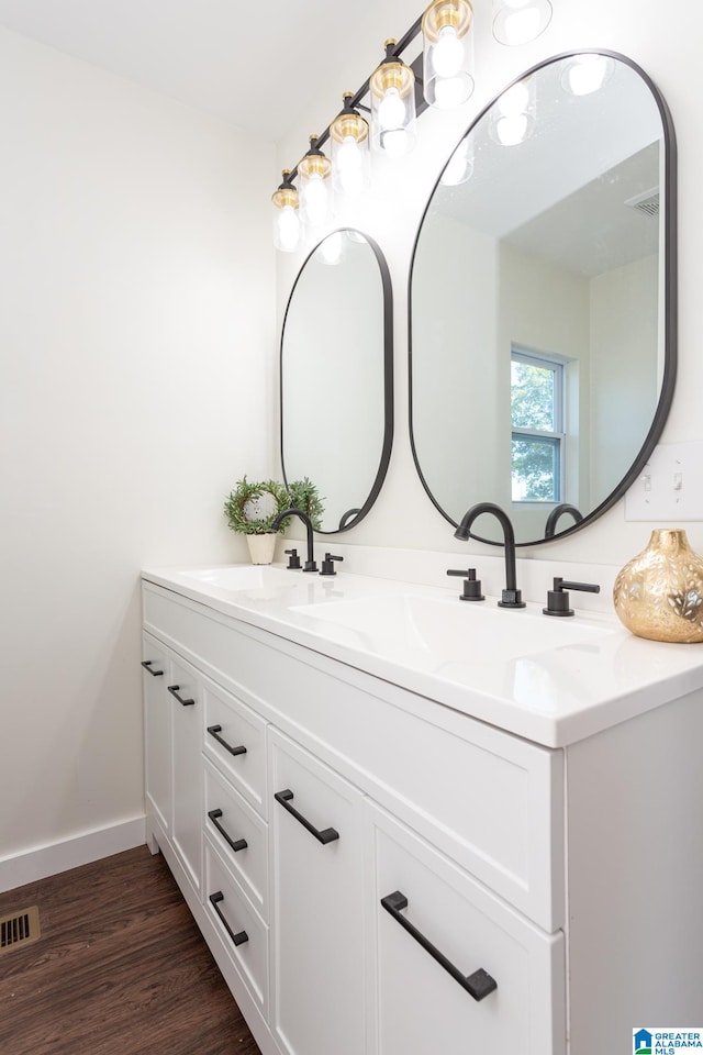 bathroom featuring vanity and wood-type flooring