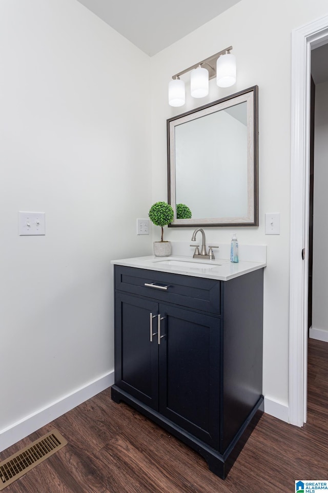 bathroom featuring vanity and wood-type flooring