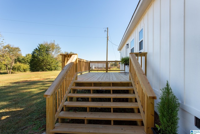 wooden deck with a yard