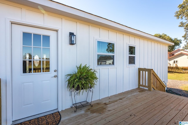 property entrance with a wooden deck