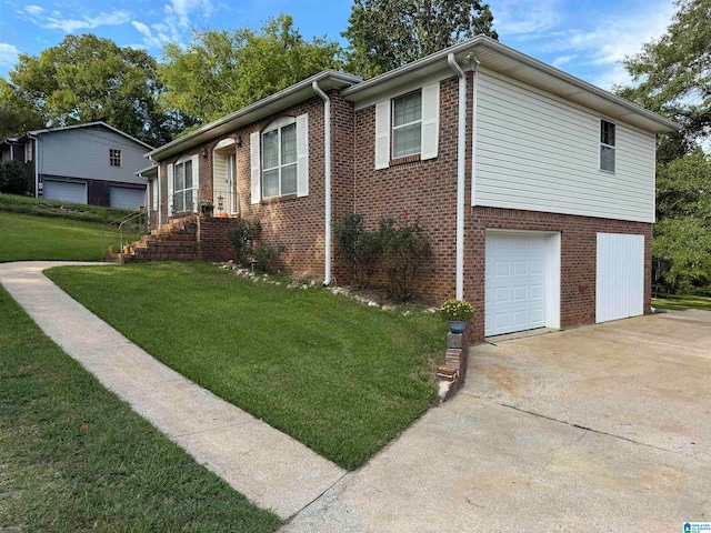 view of front of property with a front yard and a garage