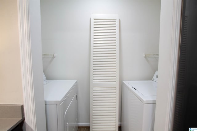 laundry room with independent washer and dryer