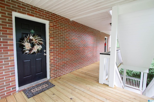 doorway to property featuring a porch