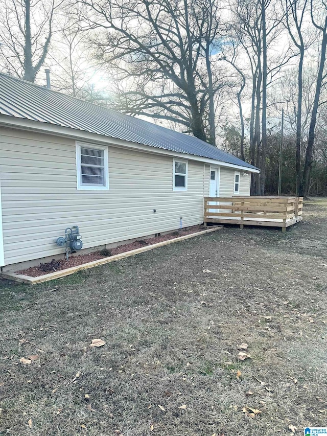 rear view of house featuring a deck