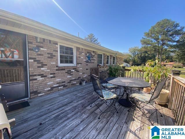 deck featuring outdoor dining area